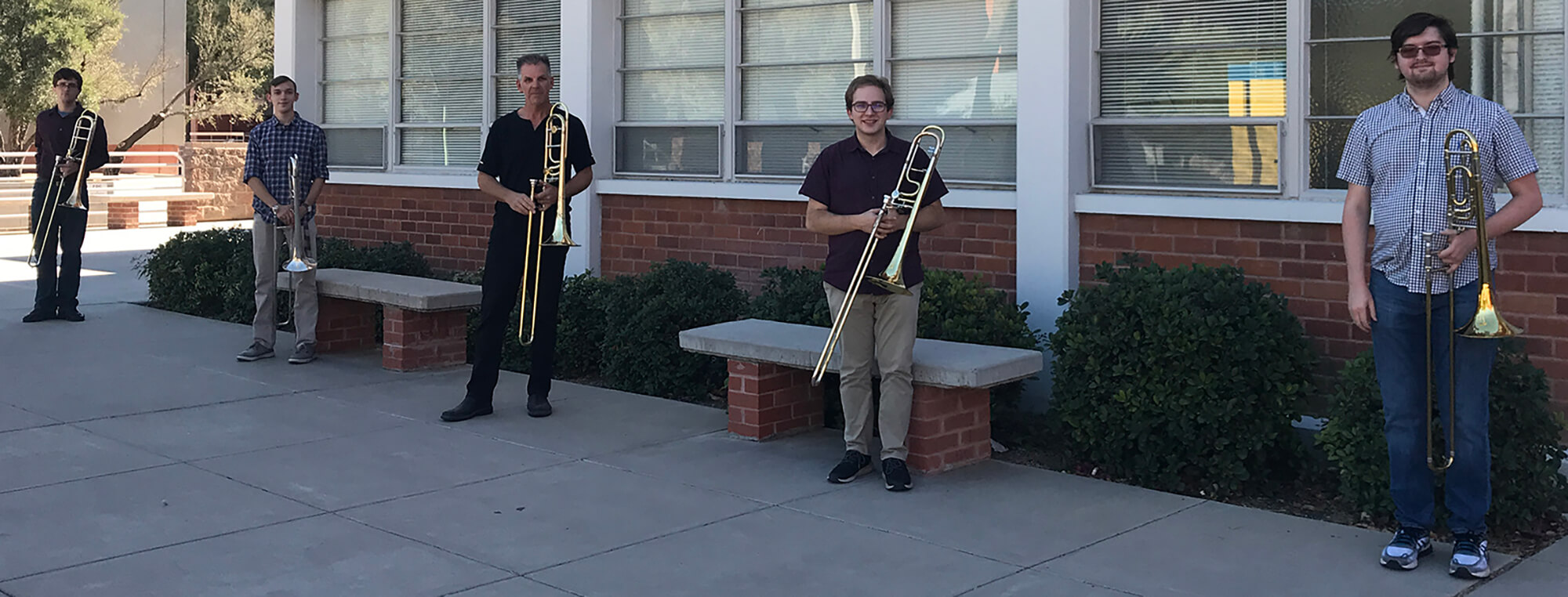TromboneStudio-Fall2020 Photo of Trombone Studio students and instructor in front of the Fred Fox School of Music building